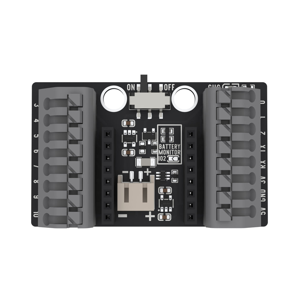 The ESP32-C3 OLED pluggable terminal base from above: a black board with a grey push-in terminal block down each side, two black sockets in the middle, a slide switch and a white battery connector.